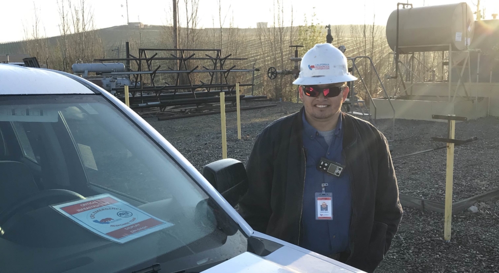 CRC employee standing by his car at a CRC facility.